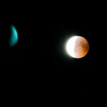Captivating lunar eclipse with celestial body in a dark night sky.